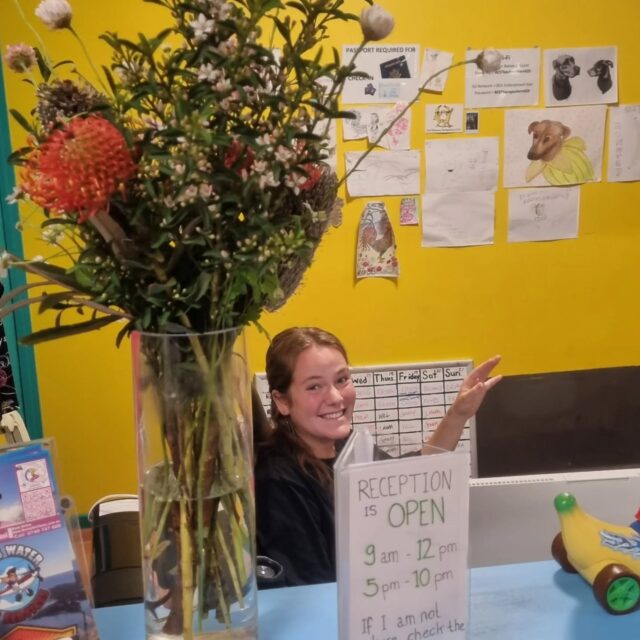 Come see this smiling face at the check in desk!